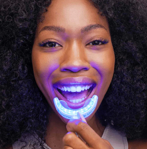 LED kit in use – Patient applying Snow whitening mouthpiece at home.
